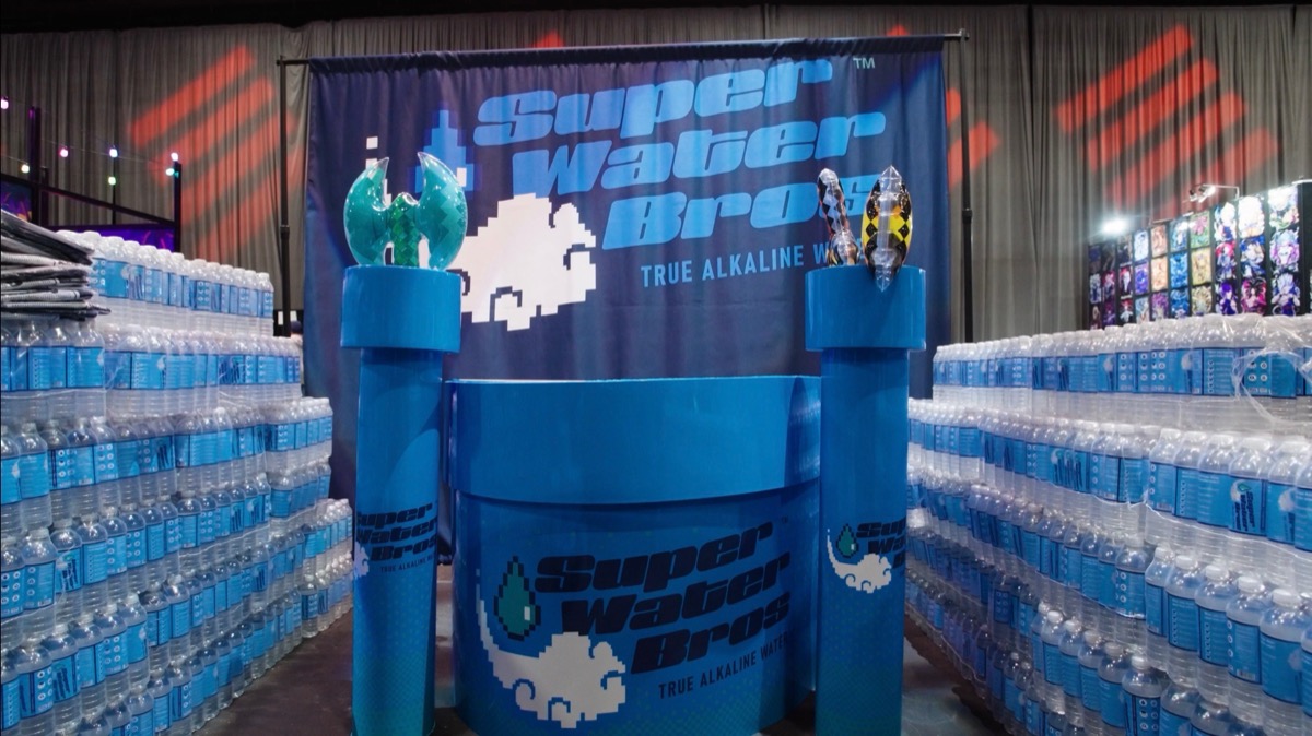 Super Water Bros booth with cases